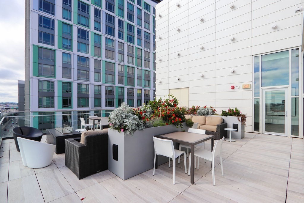 40 Traveler Street, Unit 303 Boston, MA 02118 - Photo 42 of 42 a view of a patio with couches and potted plants