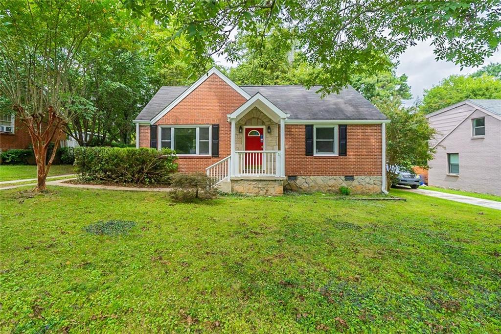 2042 Cogar Drive Decatur, GA 30032 - Photo 1 of 1 a front view of a house with a yard