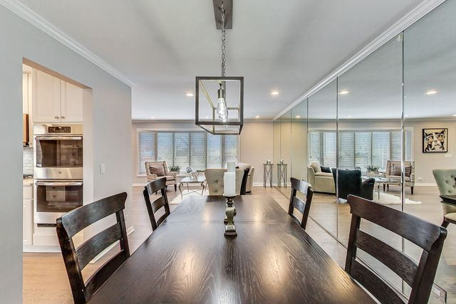 a living room with fireplace furniture and a wooden floor