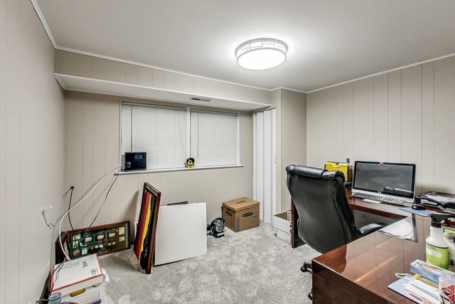 a view of workspace with wooden floor windows