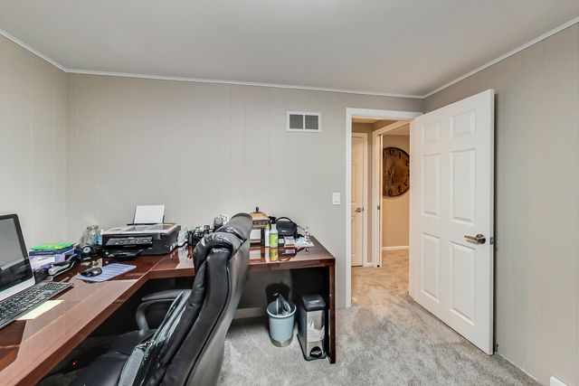 a view of a workspace with furniture