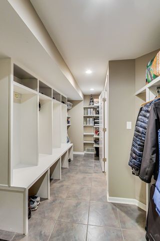 a spacious bedroom with a bed and a flat screen tv