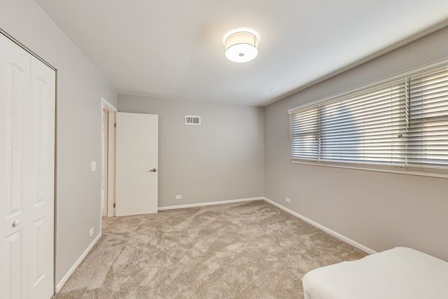 a room with gym equipment and a large window