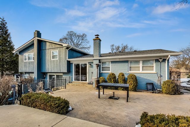 a backyard of a house with seating space
