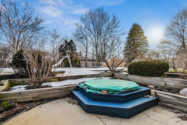 a swimming pool with outdoor seating and yard