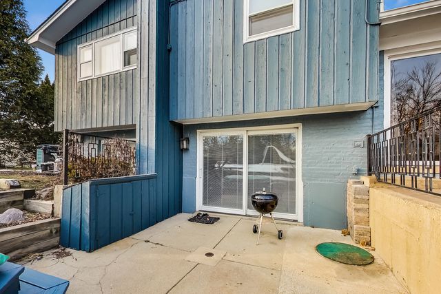 a view of a backyard with sitting area and furniture