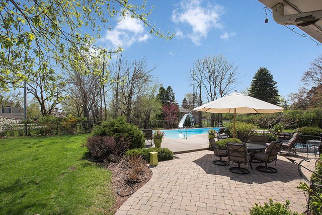 a view of a park with large trees