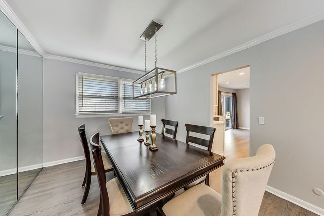 a view of a dining room with furniture and window