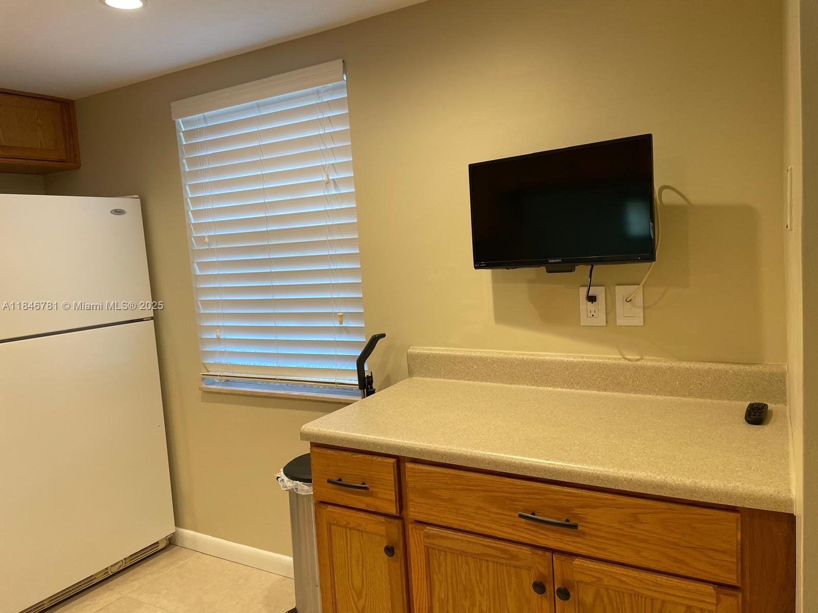 121 Southeast 3rd Avenue, Unit 201 Dania Beach, FL 33004 - Photo 12 of 49 a bathroom with a sink and a bathtub