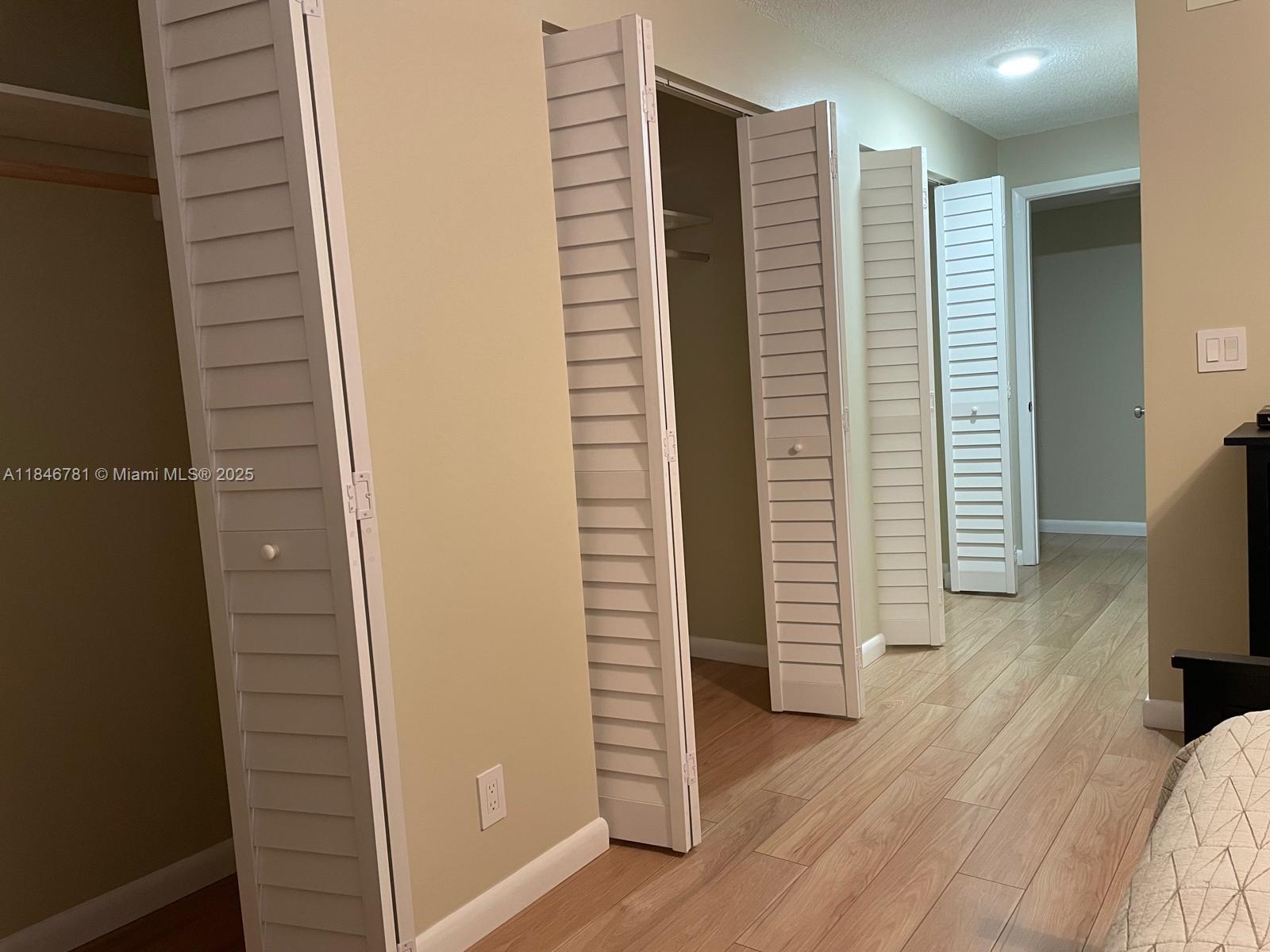 121 Southeast 3rd Avenue, Unit 201 Dania Beach, FL 33004 - Photo 16 of 49 a view of hallway with wooden floor