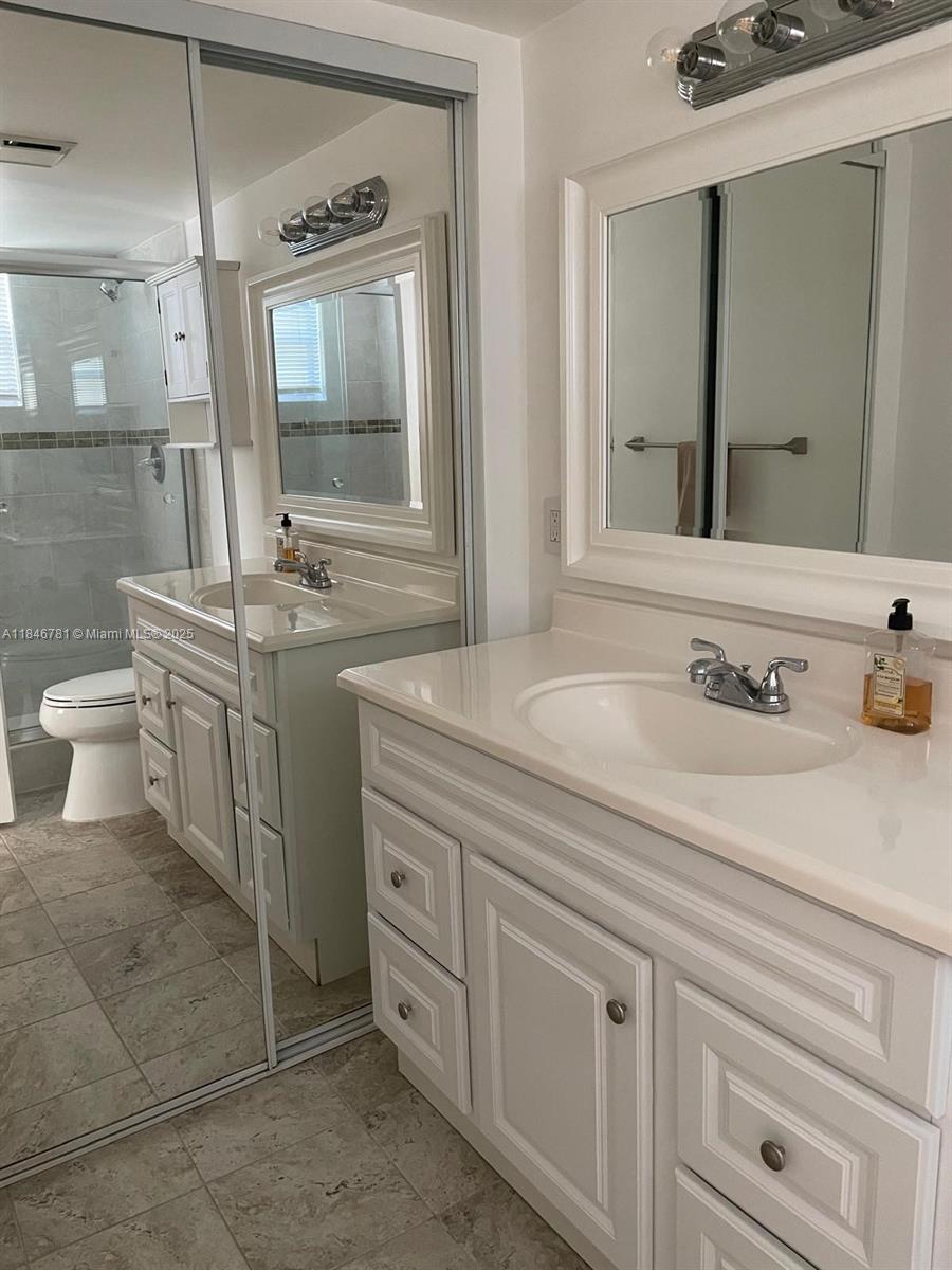 121 Southeast 3rd Avenue, Unit 201 Dania Beach, FL 33004 - Photo 18 of 49 a bathroom with a sink and a mirror