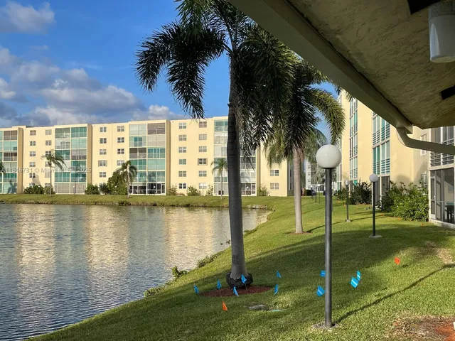 a view of a lake with a big yard