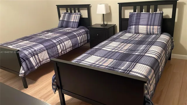 a bedroom with a bed and dresser