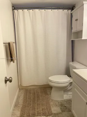 a bathroom with a sink and a toilet