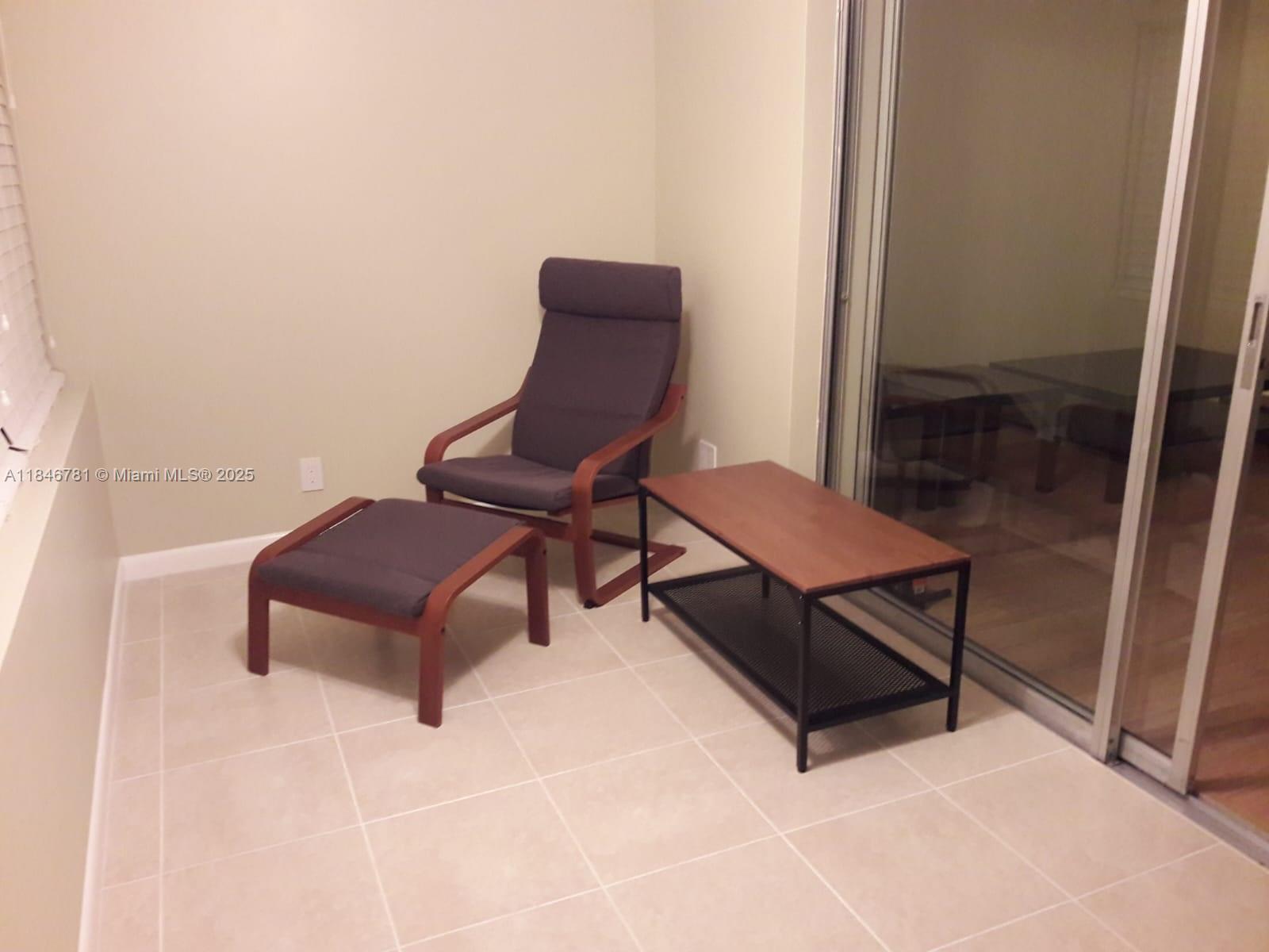 121 Southeast 3rd Avenue, Unit 201 Dania Beach, FL 33004 - Photo 31 of 49 a living room with furniture