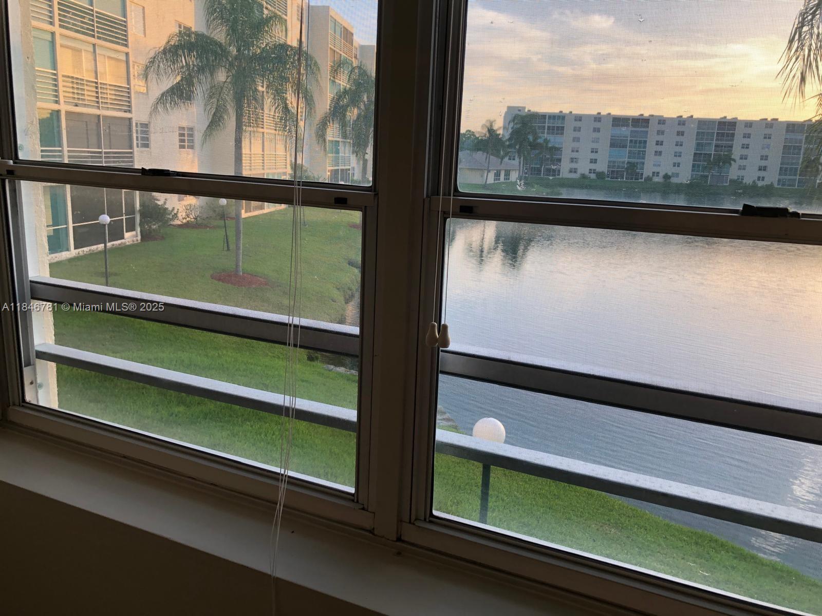 121 Southeast 3rd Avenue, Unit 201 Dania Beach, FL 33004 - Photo 35 of 49 a view of outdoor space with seating area