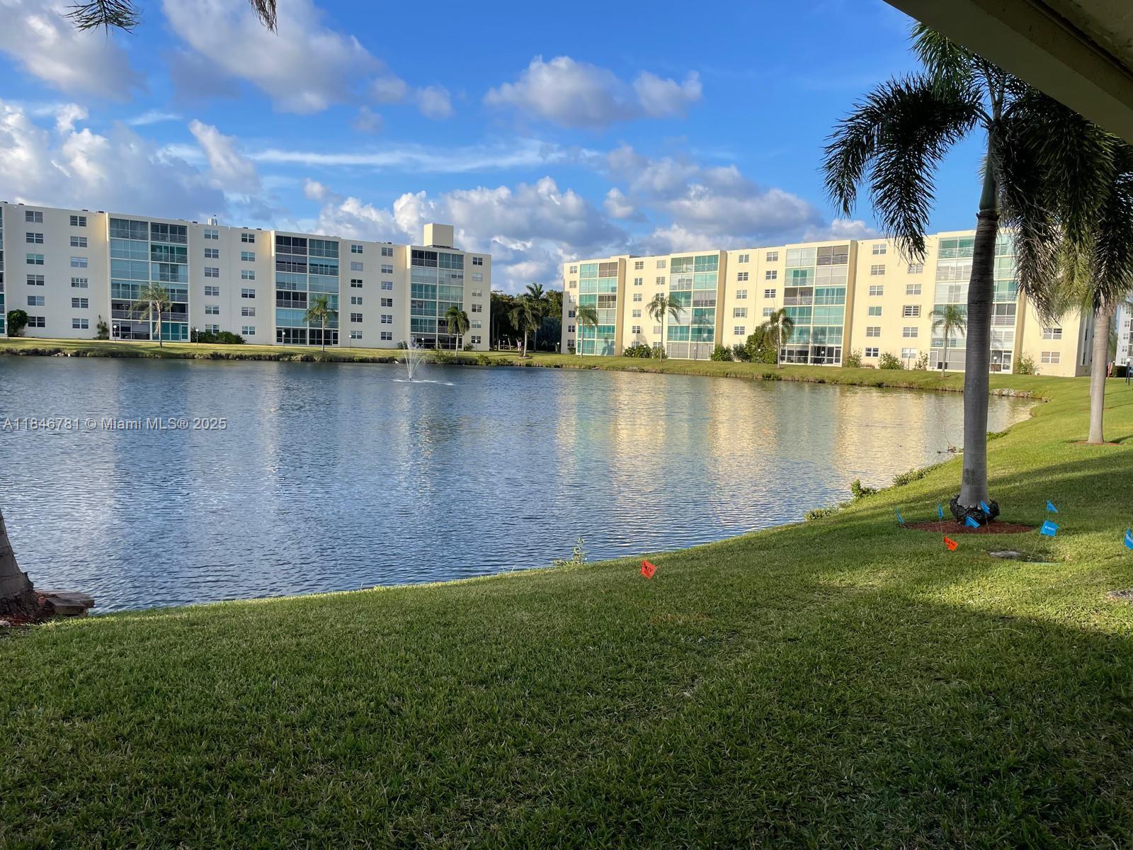 121 Southeast 3rd Avenue, Unit 201 Dania Beach, FL 33004 - Photo 36 of 49 a view of a lake with a yard