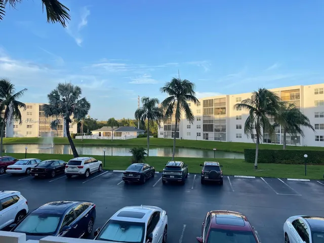 a view of a garden with lawn chairs