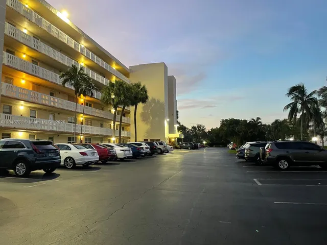 a view of street with parked cars