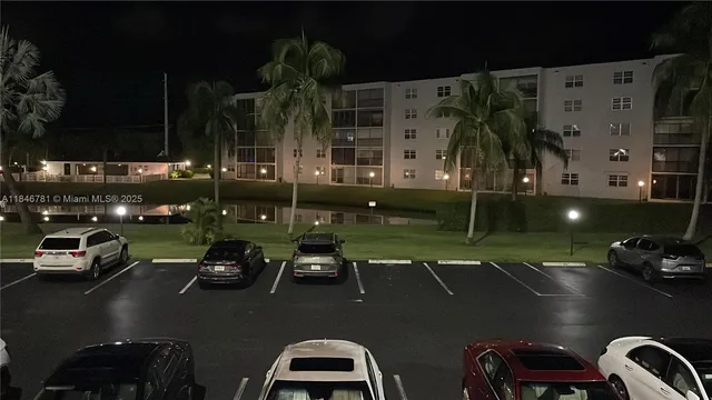 a view of a swimming pool with a table and chairs