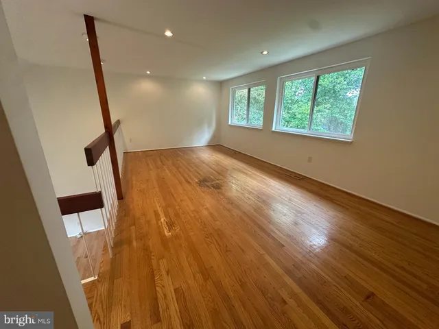 a view of an empty room and a window