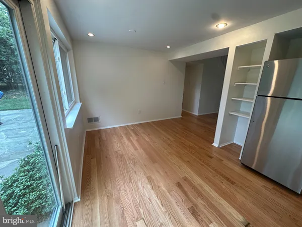a view of wooden floor in an empty room