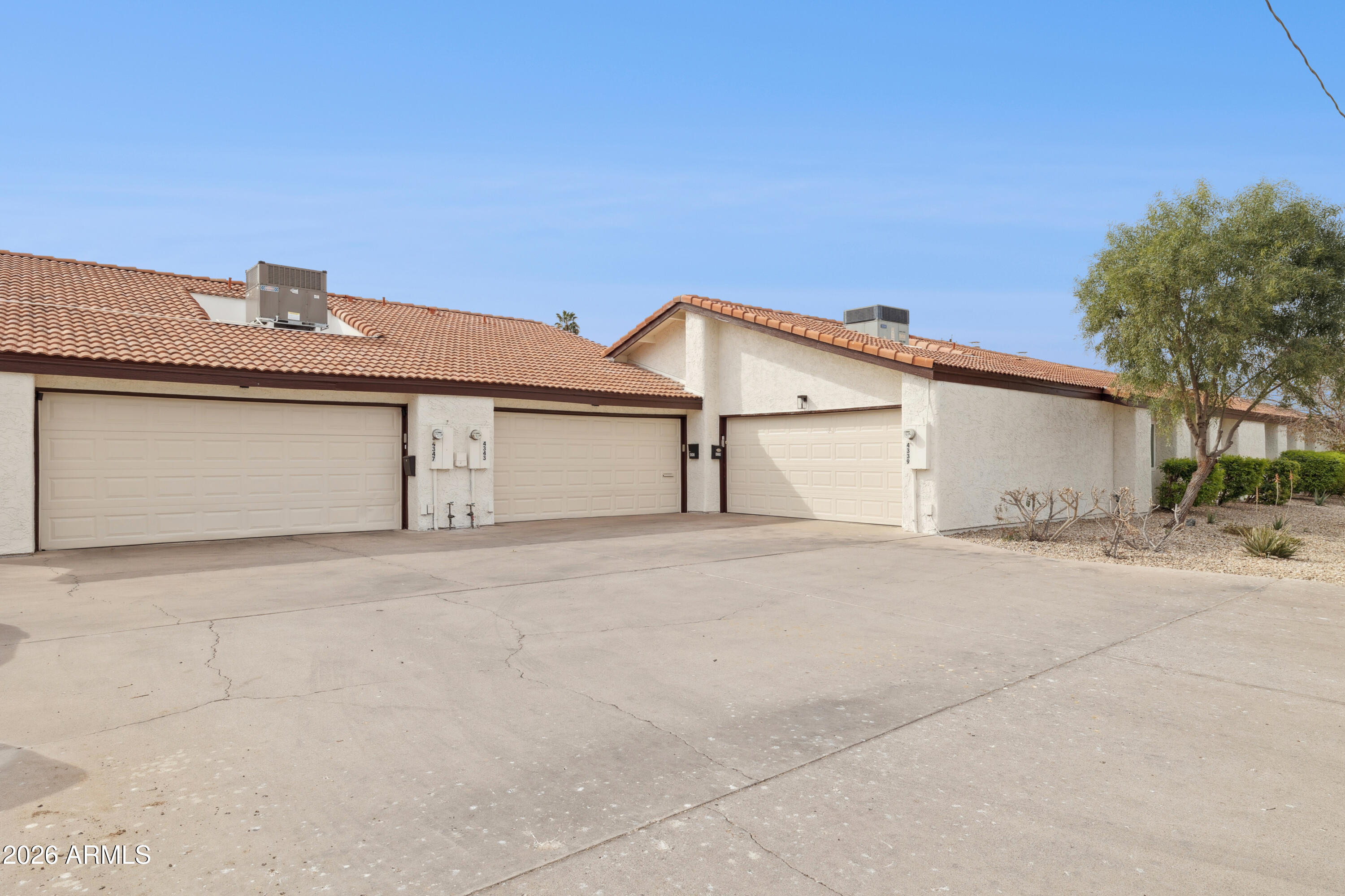 4343 East Osborn Road Phoenix, AZ 85018 - Photo 24 of 41 a front view of a house with a garage