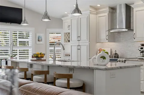 a kitchen with a stove and cabinets