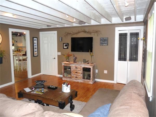 43 Colburn Road Charlton, MA 01507 - Photo 11 of 30 a living room with furniture and a flat screen tv