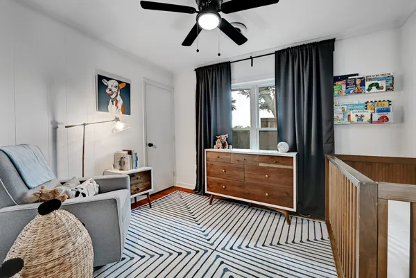 a kitchen with stainless steel appliances granite countertop a refrigerator sink and white cabinets