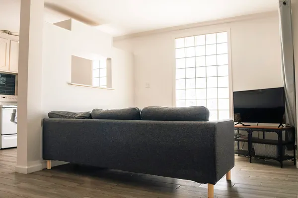 a view of swimming pool with a big yard and large trees
