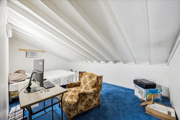 a workspace with furniture and wooden floor