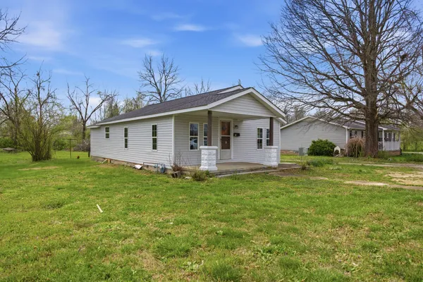 a view of a house with a big yard