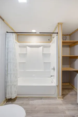 a bathroom with a bathtub and a shower