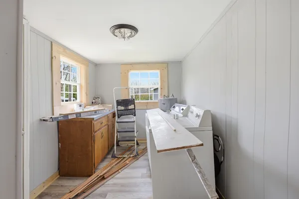 a view of a dining room with furniture and window
