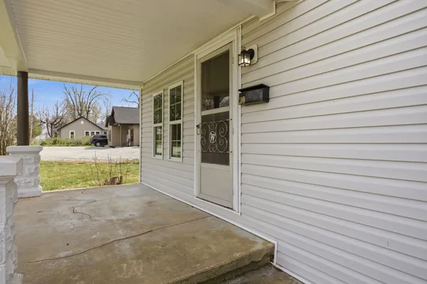 a view of front door and bedroom
