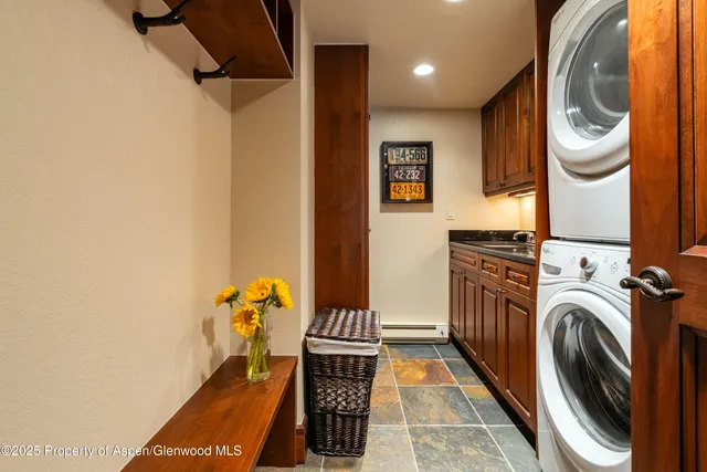 a view of a hallway with washer and dryer