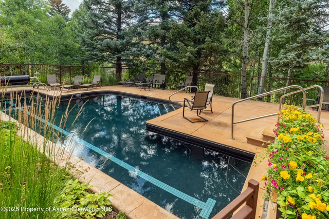 a view of swimming pool with a garden