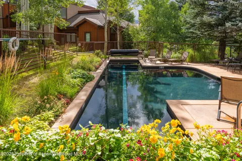 a view of a swimming pool with a patio