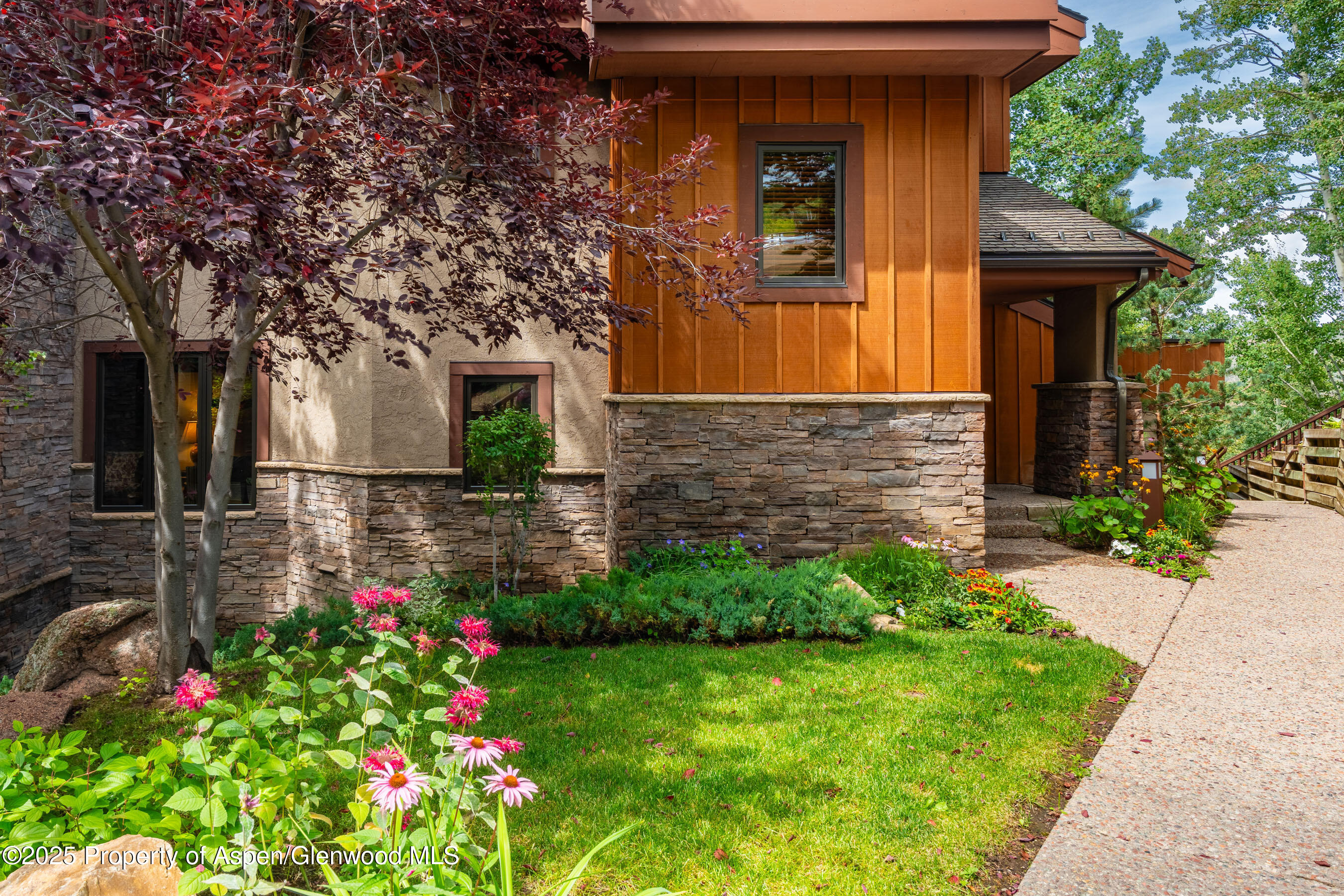 229 Faraway Road, Unit 28 Snowmass Village, CO 81615 - Photo 24 of 25 a small garden in the corner of the house