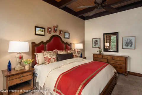 a bedroom with bed and a night stand