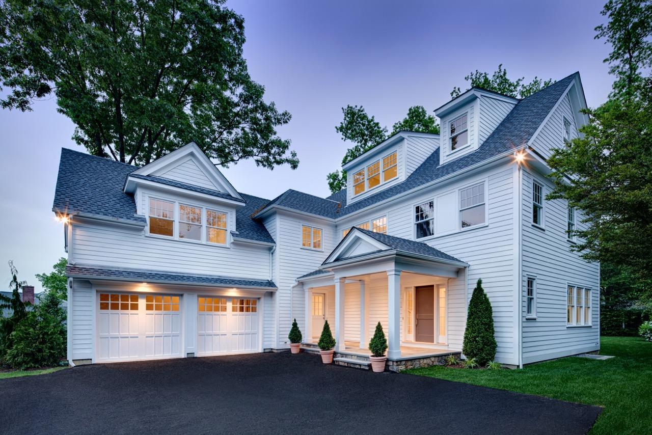 5 Top Sail Road Rowayton, CT 06853 - Photo 1 of 16 a front view of a house with a yard and garage