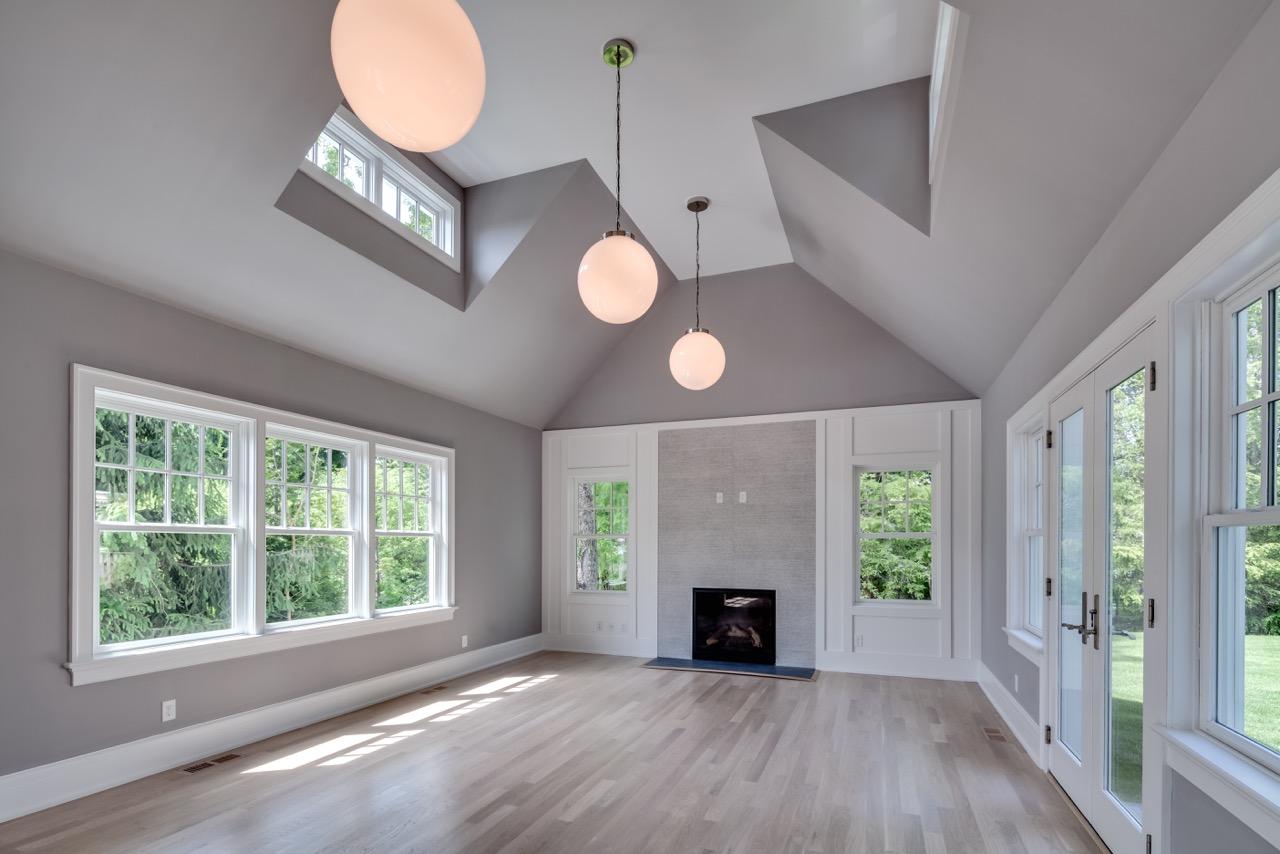 5 Top Sail Road Rowayton, CT 06853 - Photo 2 of 16 a view of an empty room with wooden floor and a window