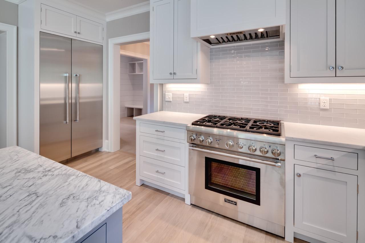 5 Top Sail Road Rowayton, CT 06853 - Photo 5 of 16 a kitchen with granite countertop cabinets stove and refrigerator