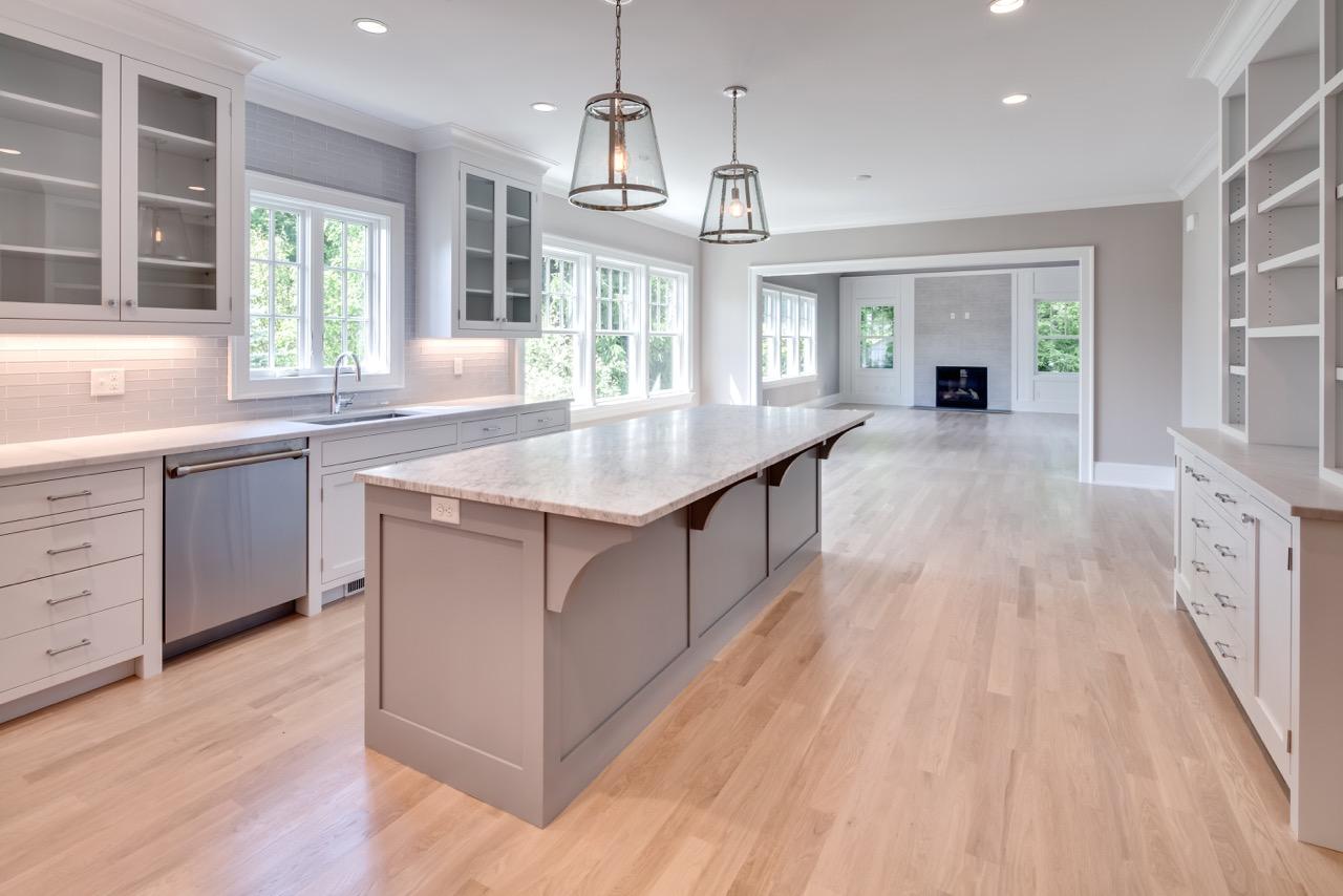 5 Top Sail Road Rowayton, CT 06853 - Photo 7 of 16 a large kitchen with kitchen island a large island wooden floor and stainless steel appliances