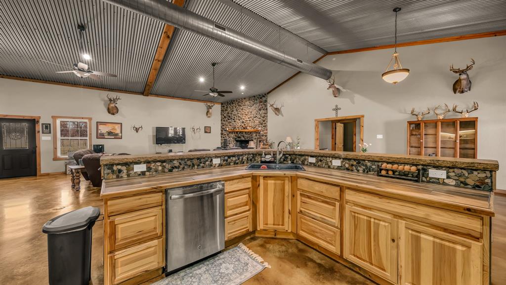 6500 Fm Road, Unit 1885 Weatherford, TX 76088 - Photo 40 of 40 a large kitchen with stainless steel appliances granite countertop a sink and cabinets