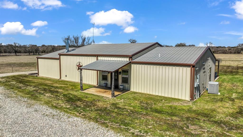6500 Fm Road, Unit 1885 Weatherford, TX 76088 - Photo 2 of 40 a front view of a house with a yard