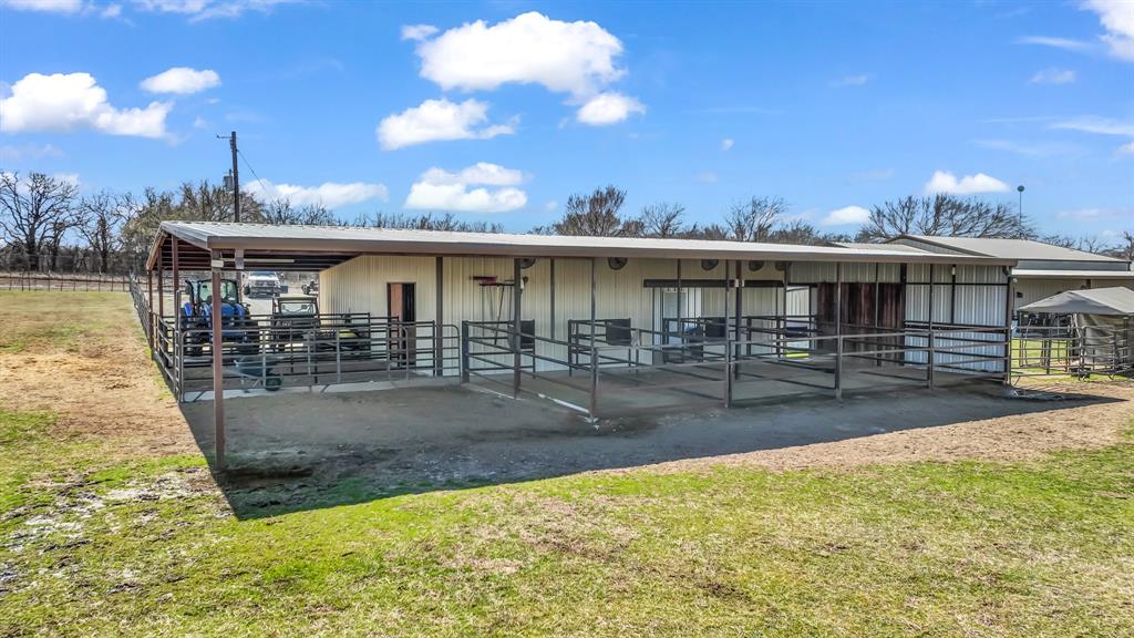 6500 Fm Road, Unit 1885 Weatherford, TX 76088 - Photo 21 of 40 a view of a patio with dining table and chairs with wooden floor