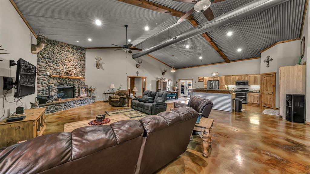 6500 Fm Road, Unit 1885 Weatherford, TX 76088 - Photo 3 of 40 a living room with lots of furniture and kitchen view