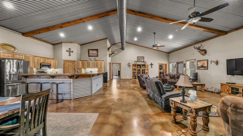 6500 Fm Road, Unit 1885 Weatherford, TX 76088 - Photo 6 of 40 a living room with lots of wooden furniture and a large window